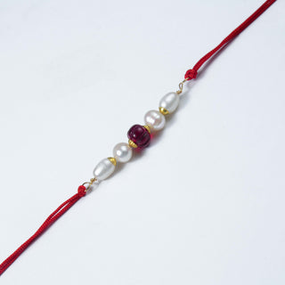 Real Pearl Bracelet featuring genuine freshwater pearls and a hand-carved aventurine gemstone on a red adjustable cord. 
