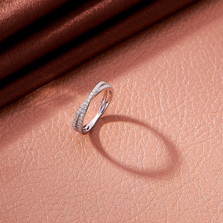 Silver ring on a textured pink surface